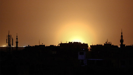 Flames rising in the distance which are believed to be coming from Damascus International Airport following an explosion early in the morning of April 27, 2017. ©
Sameer Al-Doumy / AFP