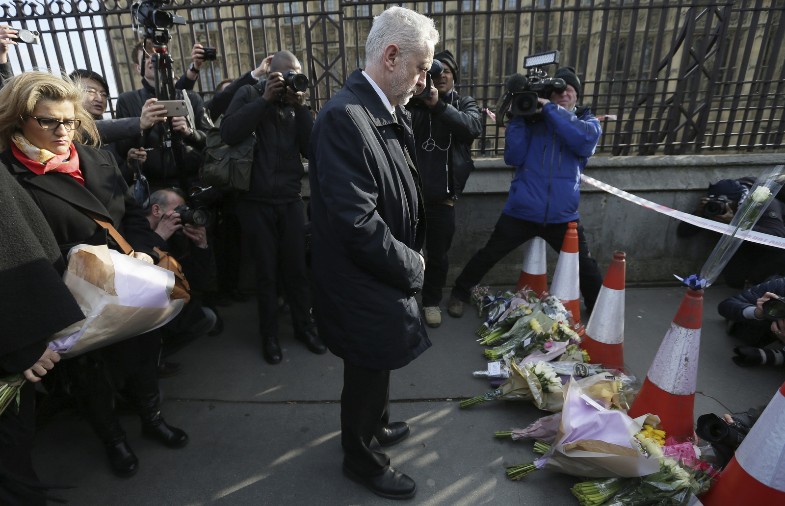 Jeremy Corbyn, the leader of Britain's Labour Party arrives to lay flowers as a tribute to the victims of Wednesday's attack, is placed near the Houses of Parliament in London, Thursday March 23, 2017. (AP/Tim Ireland)