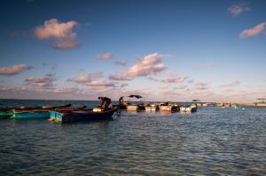 Small idyllic fishing ports - How Chinese state media depict fishermen. Larger vessels protected by Chinese Coast Guard units tell China's neighbors that there are bigger fish to fry.