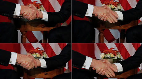 US President Donald Trump and French President Emmanuel Macron amid one of their fierce handshakes © Jonathan Ernst 