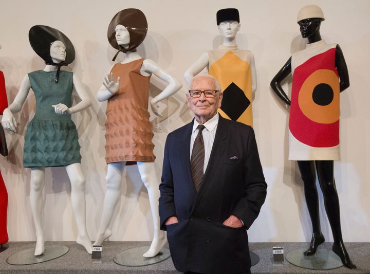 Pierre Cardin poses with dresses during the inauguration of the Pierre Cardin Museum in Paris in 2014.