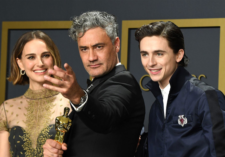 Maori Jewish director Taika Waititi with Natalie Portman [L] and Timothée Chalamet [R]./ STEVE GRANITZ/WIREIMAGE