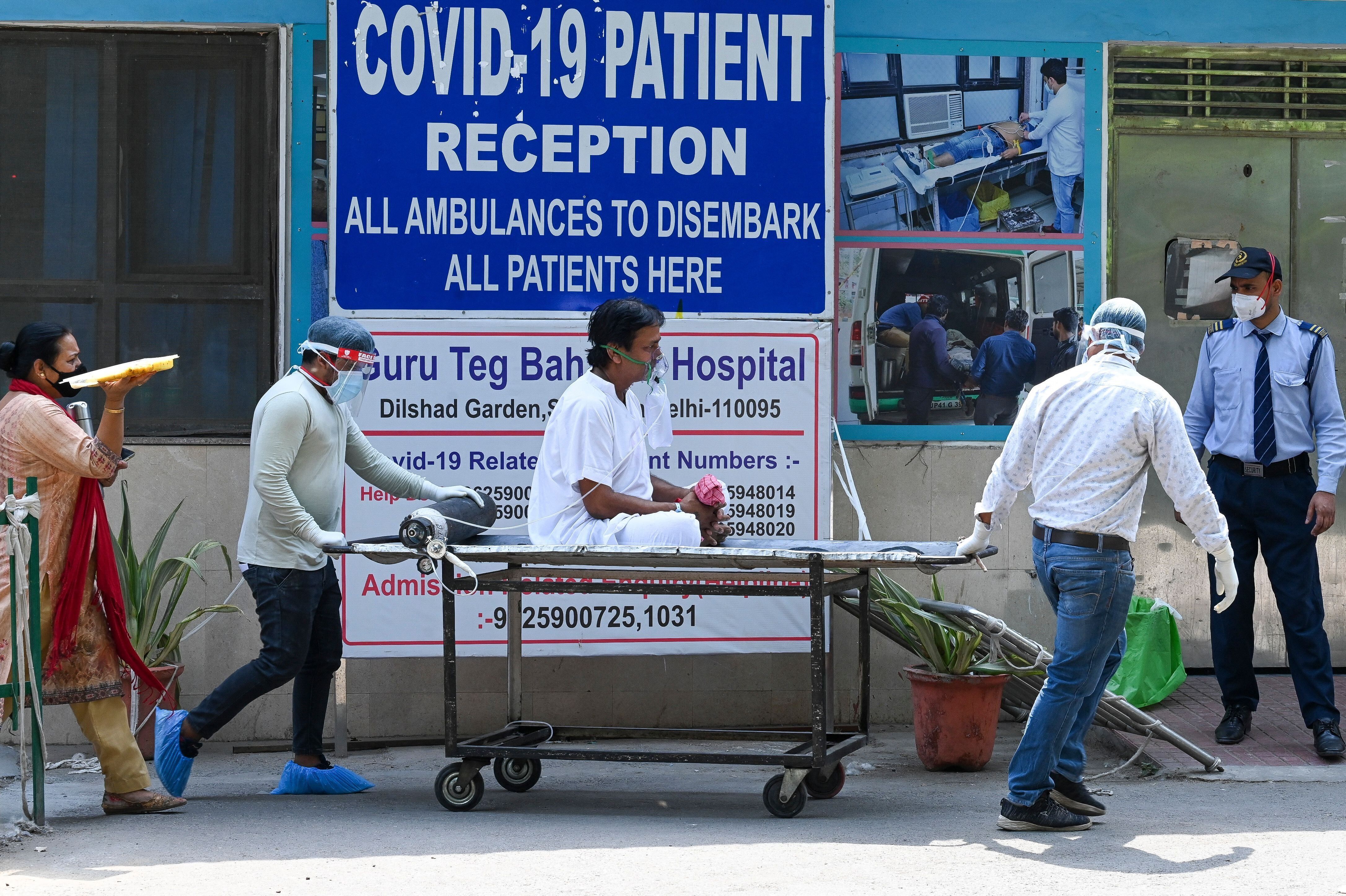 A coronavirus patient is shifted to a ward after admission at GTB hospital in New Delhi on April 29, 2021.&nbsp;
