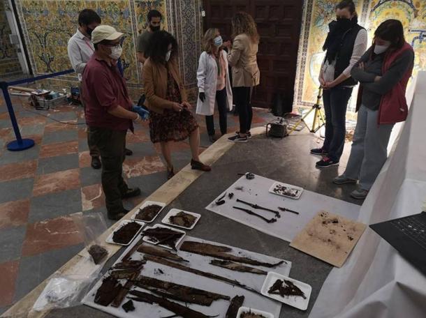 The excavated remains of the Alcázar burial, including child remains and other artifacts, on display at the dig site