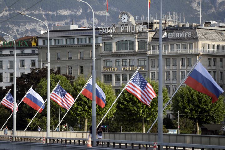 Russian and American flags fly on Mont Blanc Bridge ahead of a meeting scheduled to take place between Putin and Biden.