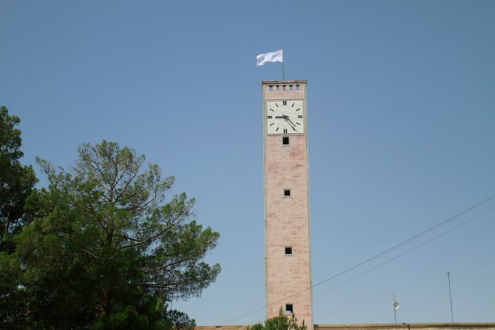 A Taliban flag flies from the clocktower of the Herat provincial official office, in Herat, Afghanistan, west of Kabul, on Sa