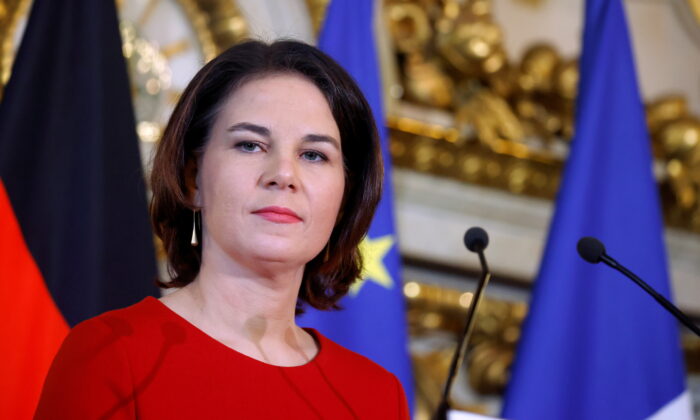 German Foreign Minister Annalena Baerbock attends a joint news conference with French Foreign Minister Jean-Yves Le Drian (not seen) after a meeting at the Quai d'Orsay in Paris, on Dec. 9, 2021. (Gonzalo Fuentes/Pool/Reuters)