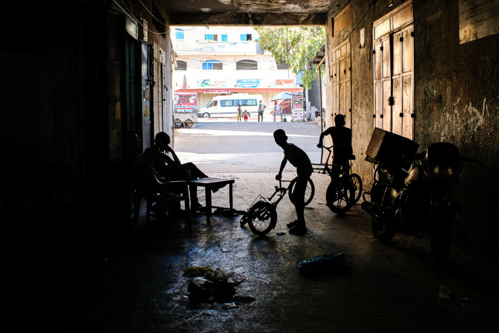 Kids seen on their bicycles in a Beit Hanoun market, September 17, 2021