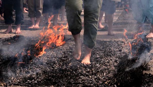 Firewalking over hot coals. Source: Tatyana / Adobe Stock