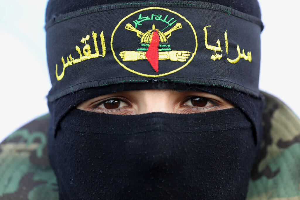 A member of Al-Quds Brigades, the military wing of the Islamic Jihad movement, takes part in condolences for Palestinians who were killed by Israeli air strikes in Rafah in the southern Gaza strip, August 8, 2022. (Photo: Ashraf Amra/APA Images)