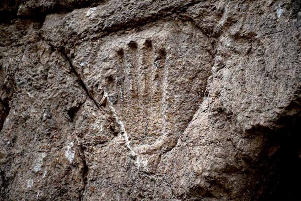 The mystery handprint was discovered on an ancient moat wall in the Old City of Jerusalem. Source: Yuli Schwartz / Israel Antiquities Authority