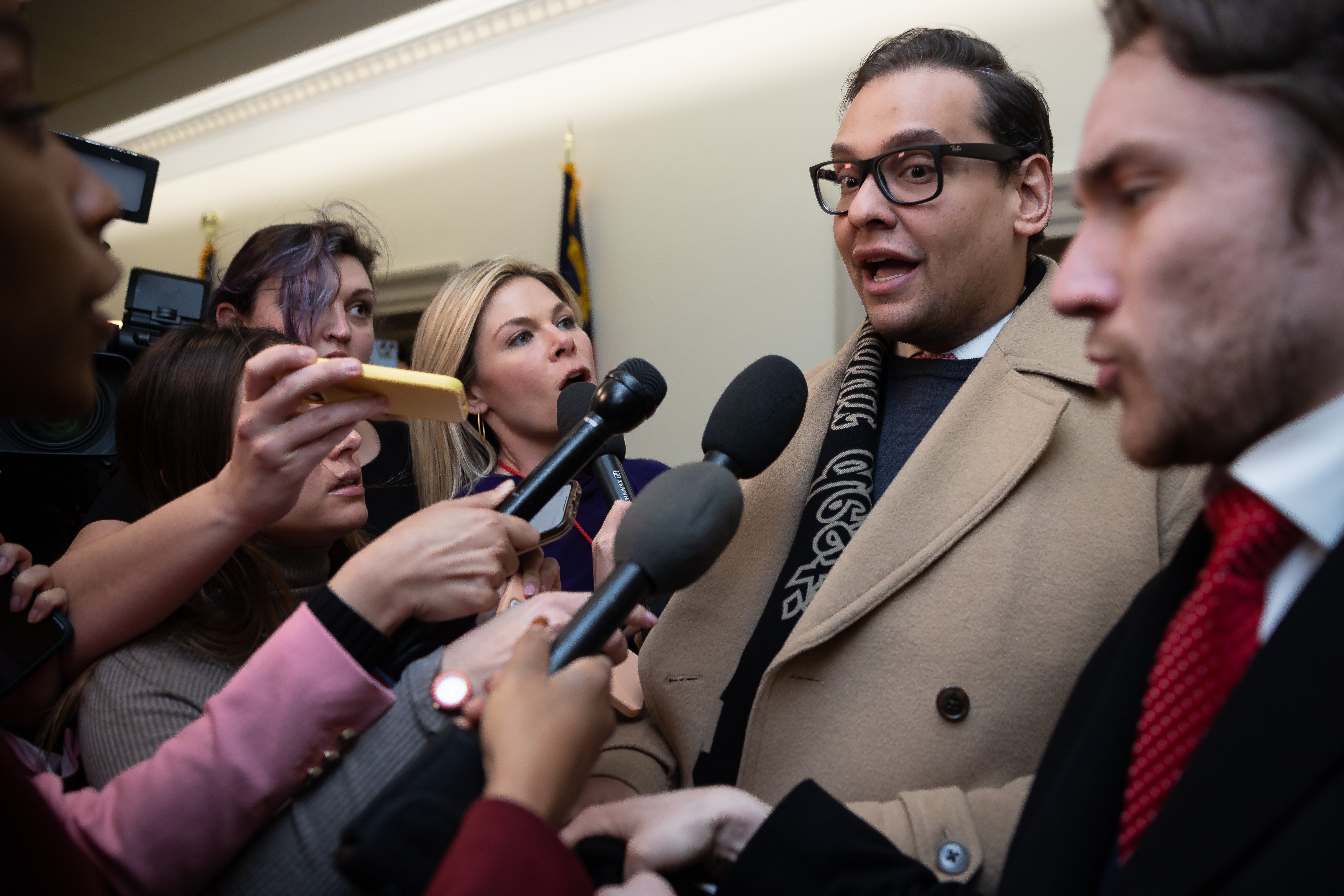 Rep. George Santos (R-N.Y.) speaks with reporters as he departs his office on Capitol Hill on Jan. 11, 2023. 