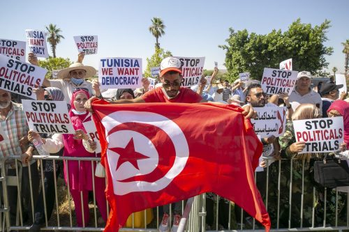 People gather during a solidarity protest with Rached Ghannouchi outside the courthouse in capital Tunis, Tunisia. [Yassine Gaidi - Anadolu Agency]