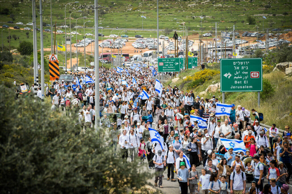 Israeli settlers march to the Evyatar outspot, near the West Bank city of Nablus, on April 10, 2023. (Photo: Sraya Diamant/Flash90)