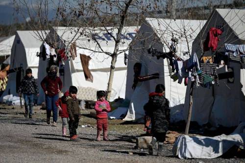 Children walk in a camp for Syrian refugee in Turkey set up by Turkish relief agency AFAD in the Islahiye district of Gaziantep on February 15, 2023. [Photo by OZAN KOSE/AFP via Getty Images]