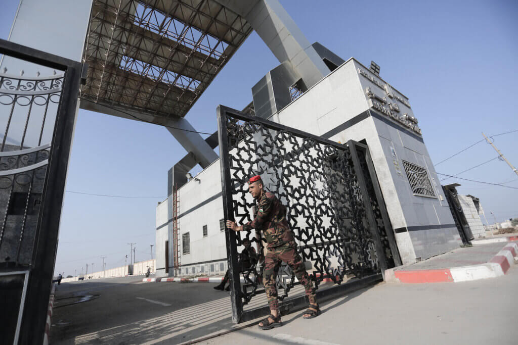 A solider closes the gate to enter the Rafah border crossing to Egypt in the southern Gaza Strip on November 1, 2023. (Photo: Stringer/APA Images)