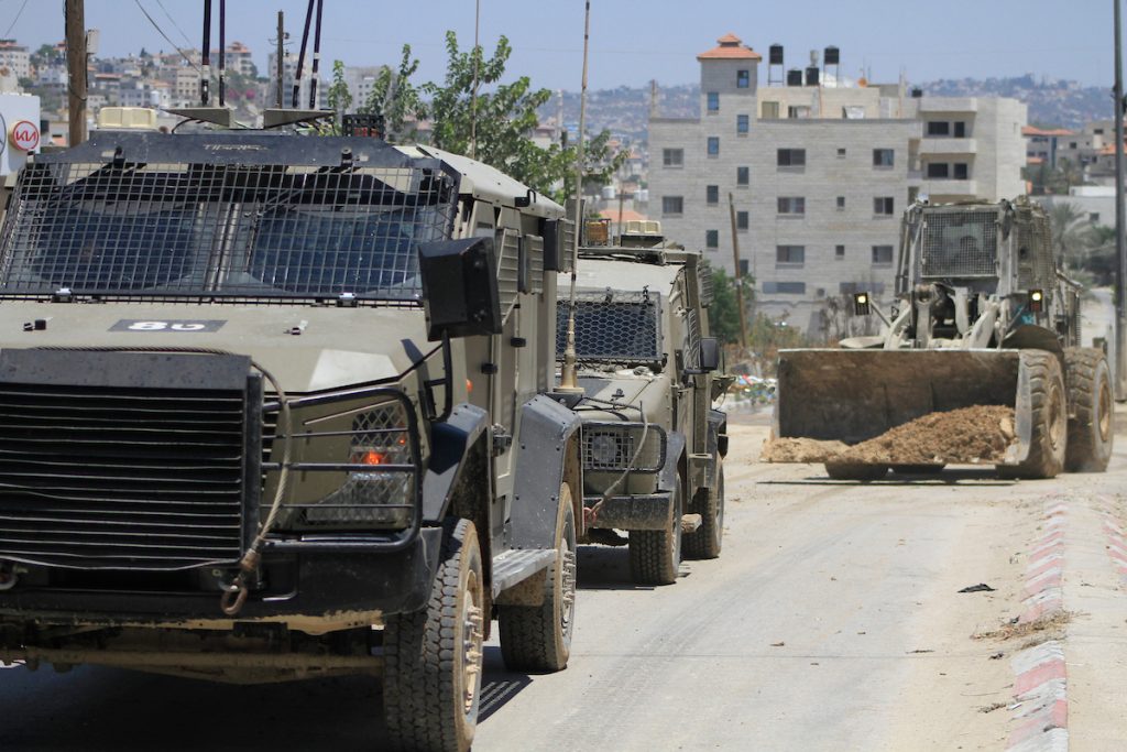 Israeli forces conduct a raid in Tulkarem in the occupied West Bank on July 23, 2024. (Photo: Mohammed Nasser/APA Images)